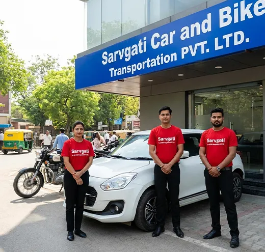 Sarvgati Car and Bike Transportation PVT. LTD. Delhi office exterior with Indian staff in red uniform standing beside a car and a bike for vehicle transport services