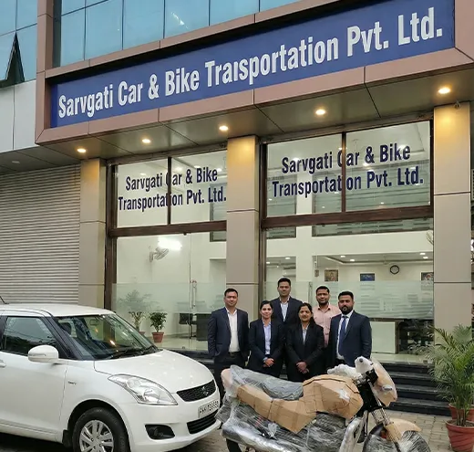 Sarvgati Car & Bike Transportation Pvt. Ltd. team with a car and bike outside their office