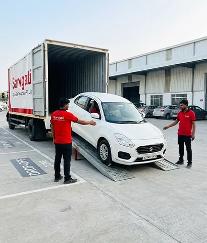 Car being unloaded from a carrier at destination