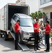 Car with RJ registration being unloaded safely at destination with final inspection