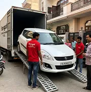 Sarvgati team delivering car with Delhi registration number plate safely to customer