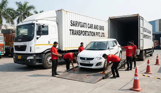 Car being loaded into a closed container carrier in Chandigarh with CH number plate