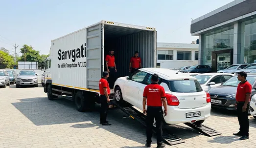 Multiple cars prepared for dealer transport from Chandigarh with closed container carrier and CH number plates