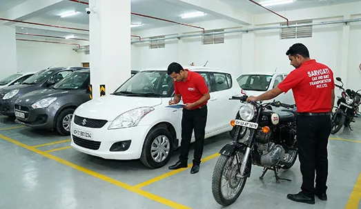 Secure vehicle storage warehouse in Chandigarh with parked cars and bikes having CH number plates