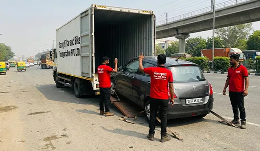Car transport service in Delhi using a closed container truck by Sarvgati Car and Bike Transportation PVT. LTD.