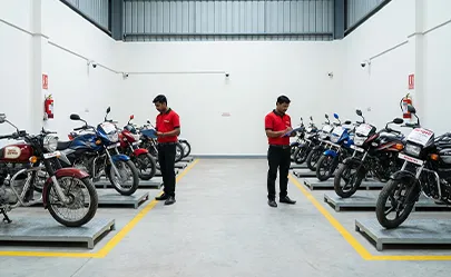 Motorcycle storage in monitored vehicle warehouse